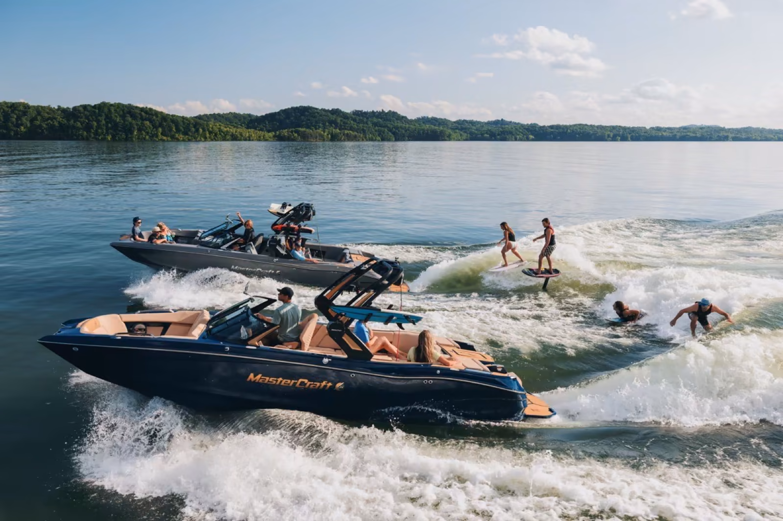 MasterCraft wake boats and wakesurfers behind the wave